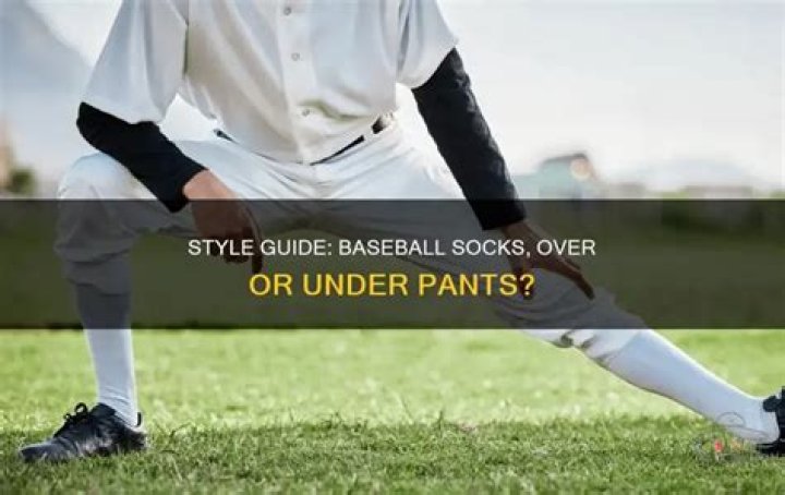 Do socks go over or under baseball pants?