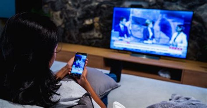 How can I watch TV channels online on my phone?