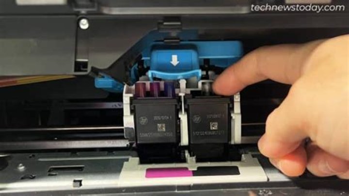 How do I change the ink in my postage machine?