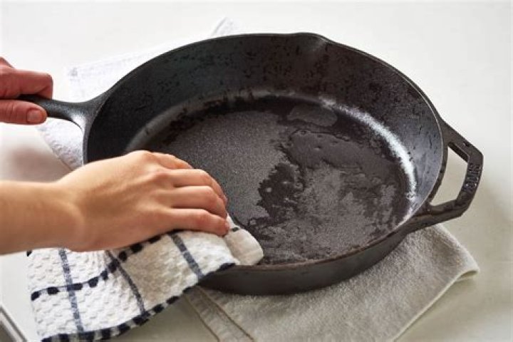 How do I make my cast iron pan look new again?