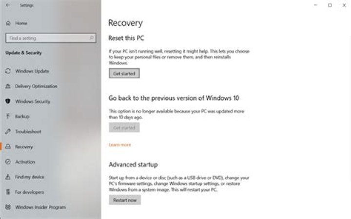 How do I restore my Windows 7 laptop to factory settings?