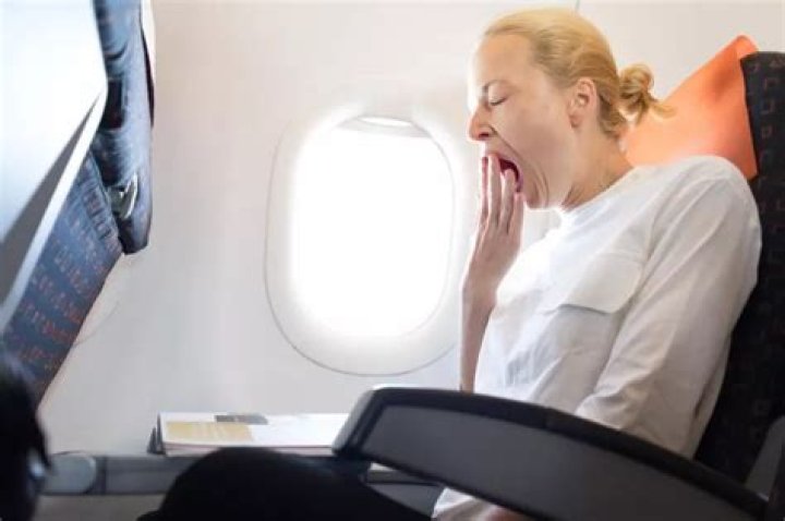How do I unclog my ear after flying?