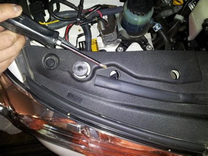 How do you adjust the headlights on a 2008 Chevy Equinox?