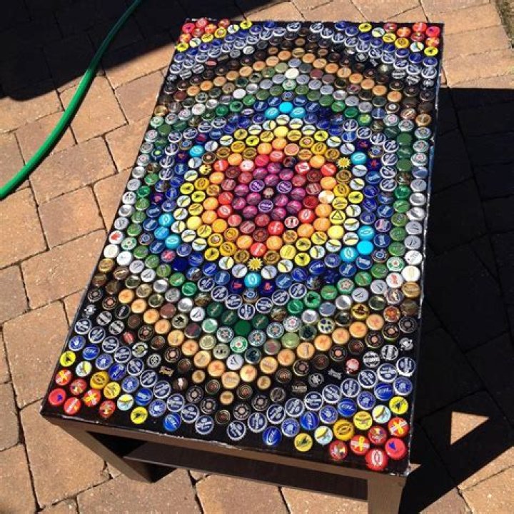 How do you attach bottle caps to a table?