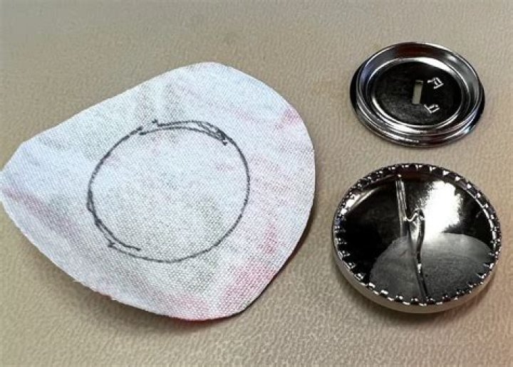 How do you attach fabric covered buttons?