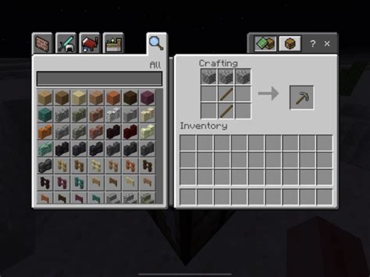 How do you make a metal pickaxe in Minecraft?