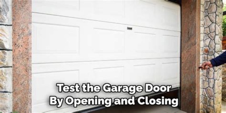 How do you open a jammed garage door?