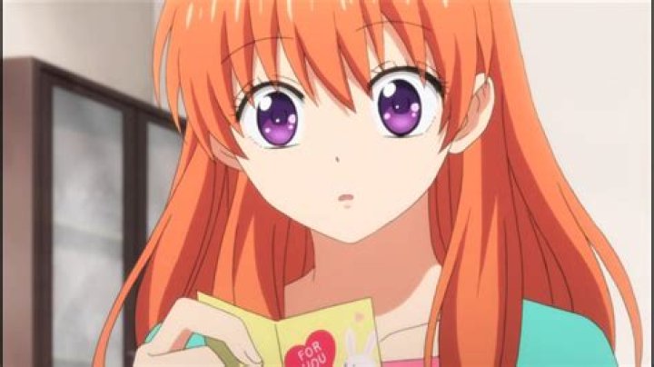 What anime has a girl with orange hair?