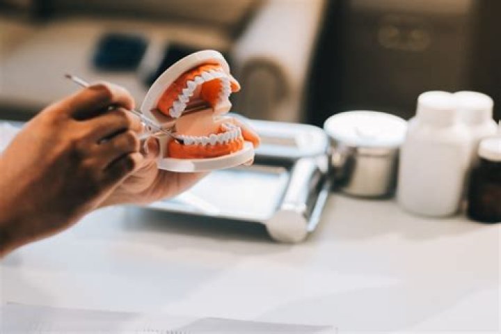 What are permanent dentures and how do they work?