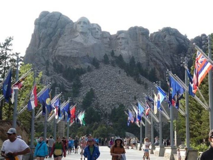 What can visitors see at Mount Rushmore?