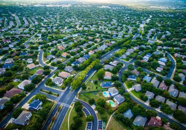 What defines a suburban area?