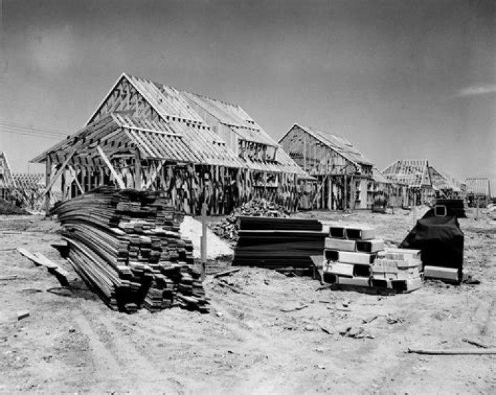 What happened when developers such as Levittown built affordable mass-produced houses?
