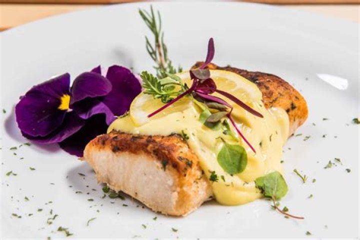 What is a garnish used for in food presentation?