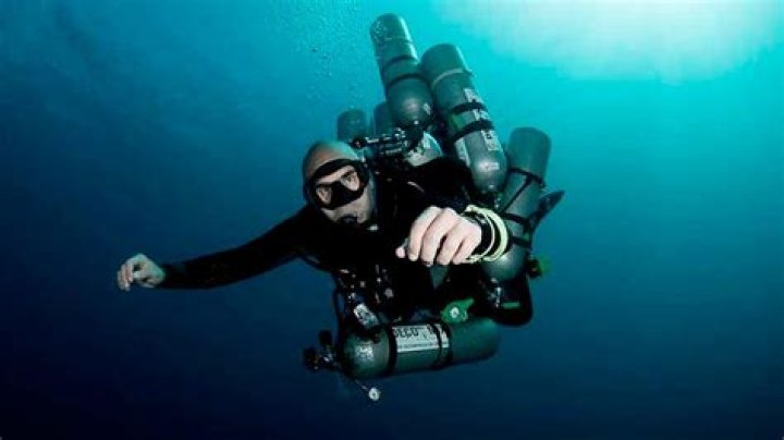 What is considered a deep dive in scuba?