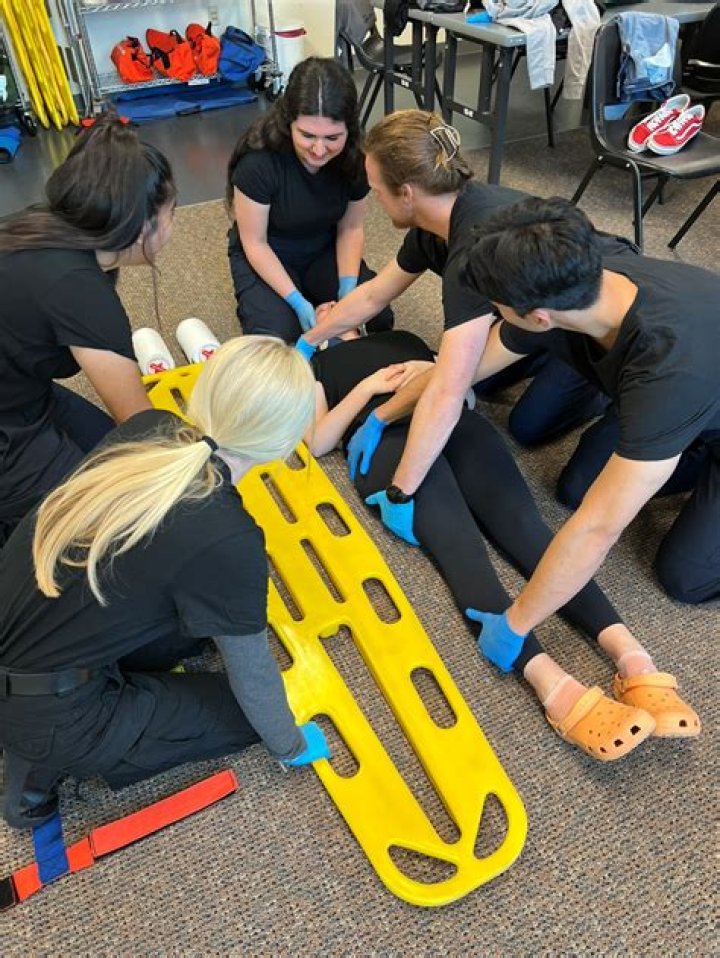 What is manual spinal immobilisation?