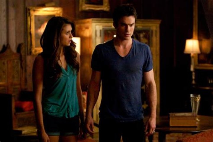 What scene do Elena and Damon sleep together?