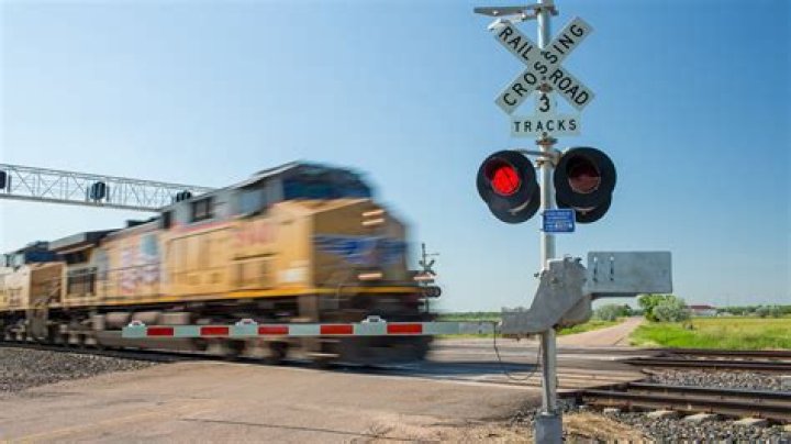 What signs markings identify a railroad crossing?