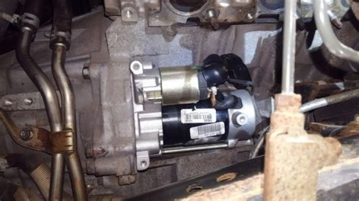 Where is the starter located on a Toyota Tundra?