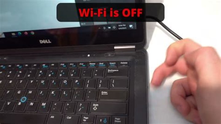Where is the WiFi button on a Dell Inspiron laptop?