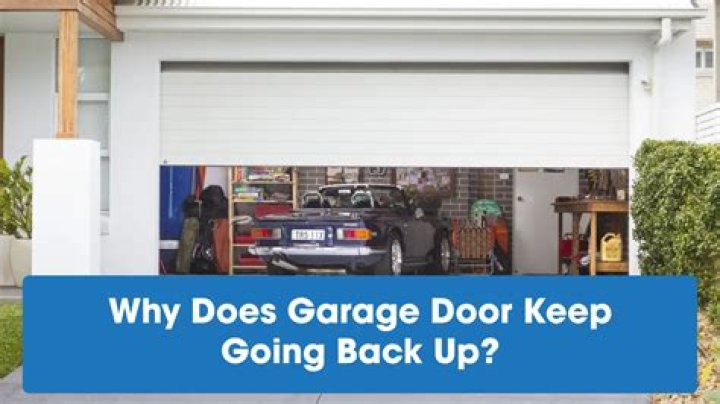 Why does my garage door keep going up and down on its own?